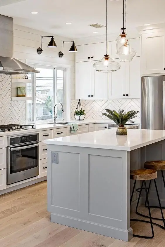 White and Grey farmhouse kitchen: White and grey base, then bubble glass pendants, black sconces and rustic stools. Compact