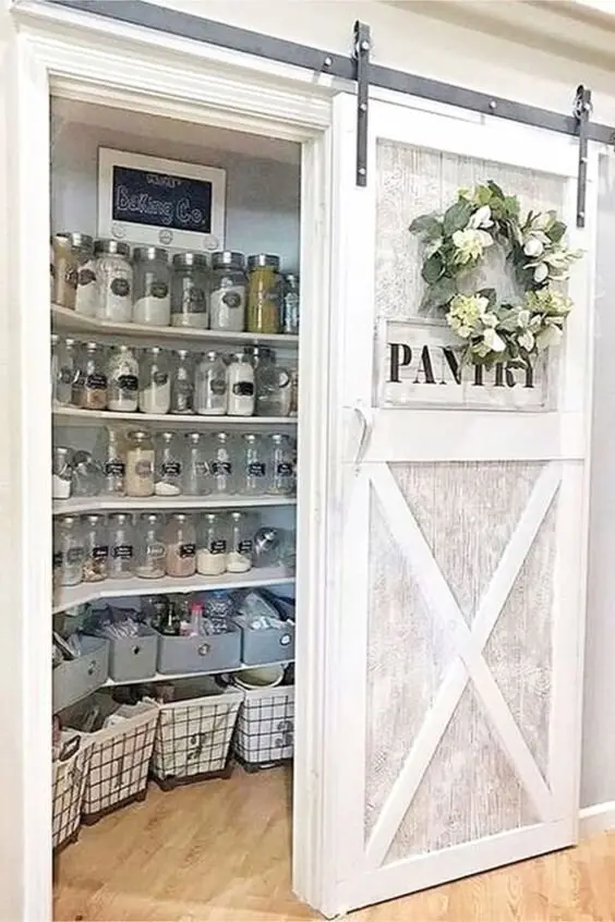 Sliding Barn Door farmhouse kitchen: A sliding barn door on the pantry saves the swing space of a hinged door and adds the
