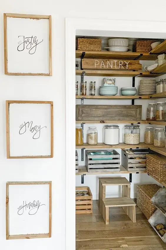 Farmhouse Pantry farmhouse kitchen: A pantry organised country-style: crates, baskets, vintage jars and timber boxes instead