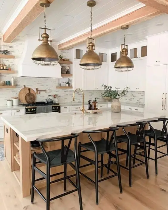 Vintage Accents farmhouse kitchen: A modern kitchen shifted toward farmhouse with copper pendants, timber accents and copper