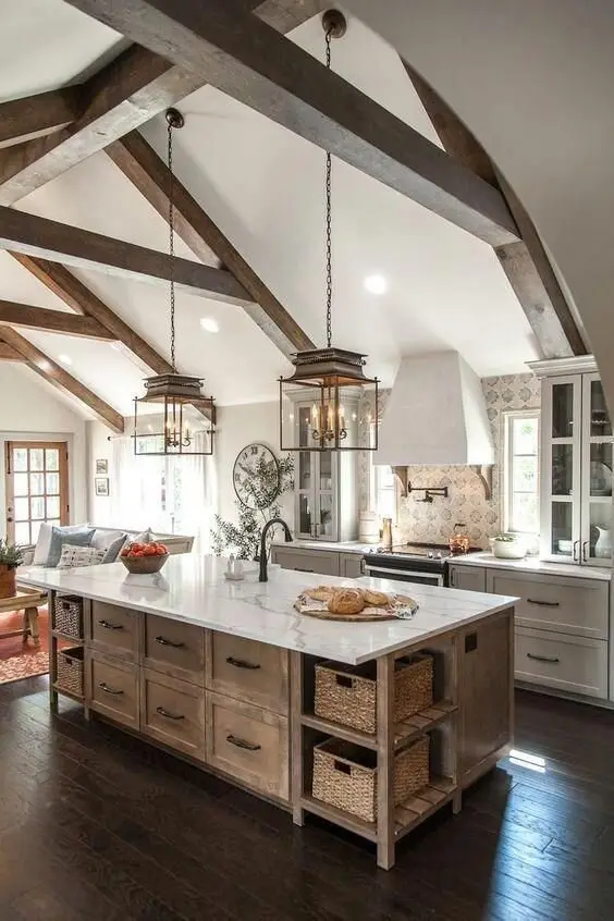 Cosy and Classic farmhouse kitchen: A smallish kitchen made to feel bigger by a beamed cathedral ceiling. Marble-topped