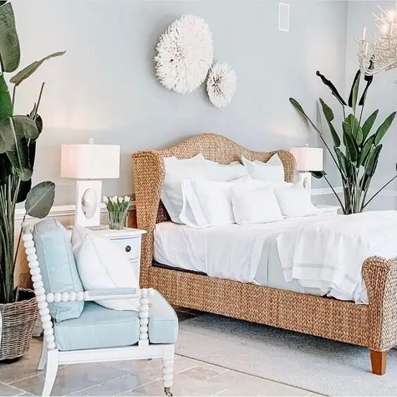 Seagrass Bed coastal bedroom: A woven seagrass bed frame, one big natural-fibre statement in a bright room. Commercial