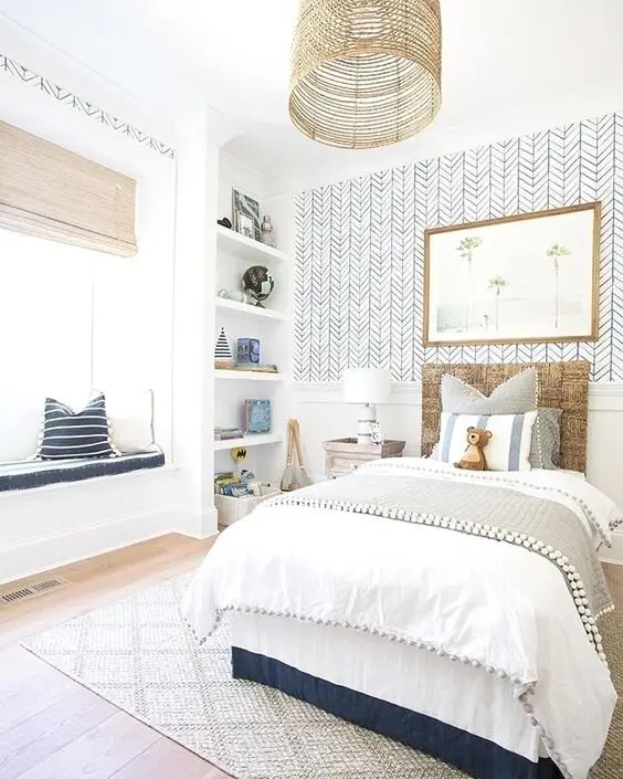 White Delight coastal bedroom: White on white, saved from blandness by herringbone wallpaper, pompom tassels and natural