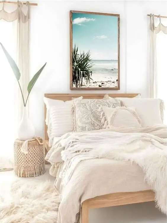 Bright Bohemian coastal bedroom: A DIY pallet bed, textured pillowcases, tab-top curtains and a macrame-trimmed night table