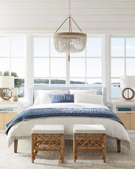 Open Windows coastal bedroom: Window walls facing the water. If the view exists, the design job is mostly getting out of its