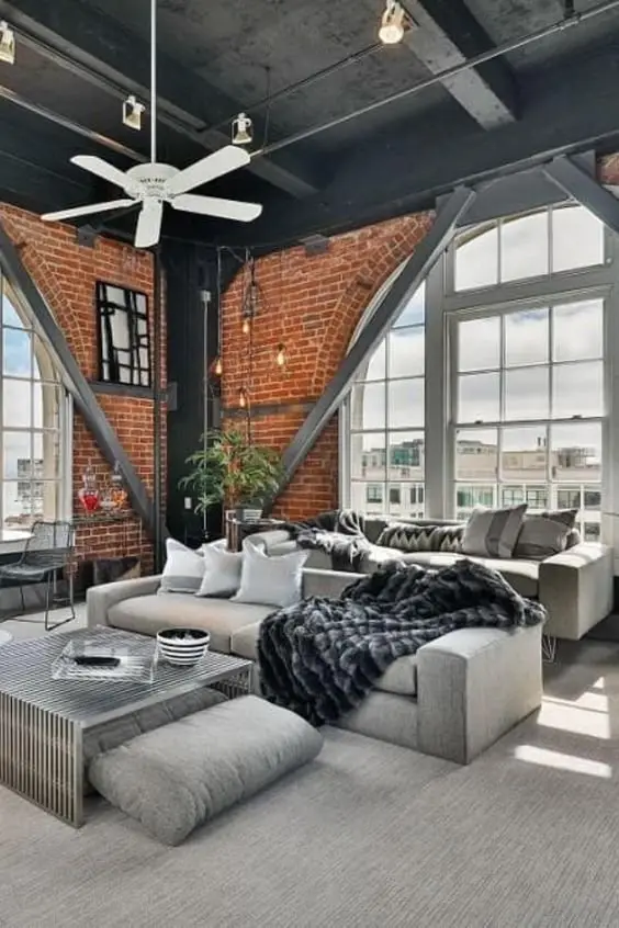 Steel and Grey industrial living room: Unmistakably modern, this apartment living room has strong industrial roots