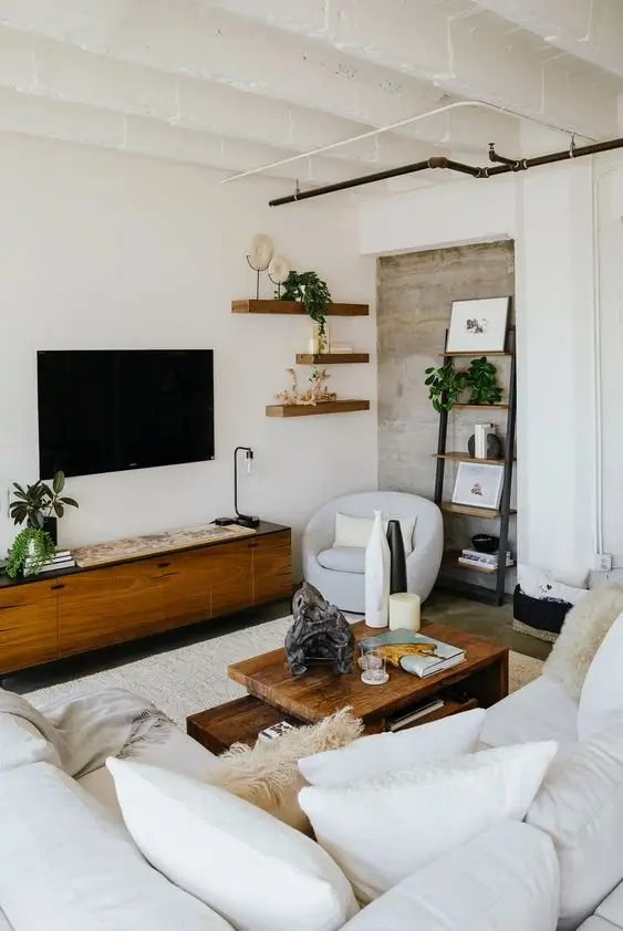 White Industrial industrial living room: Comfy and snug, this small living room is also bright and welcoming