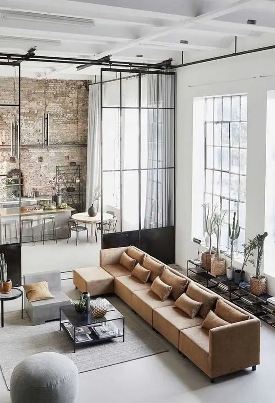 Bright Industrial industrial living room: This modern and bright living room is the antithesis of the conventional gloomy industrial styling
