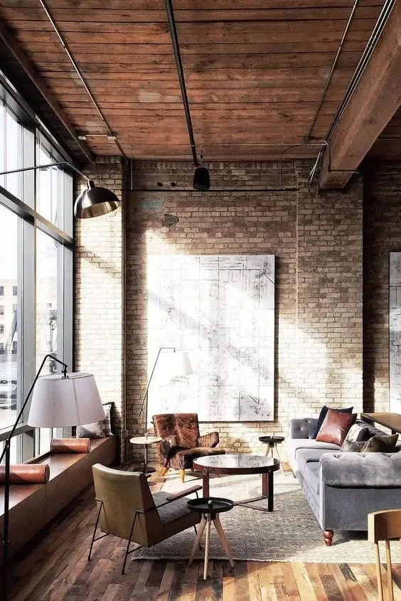Old World Charm industrial living room: The highlight of this room is its old-world charm